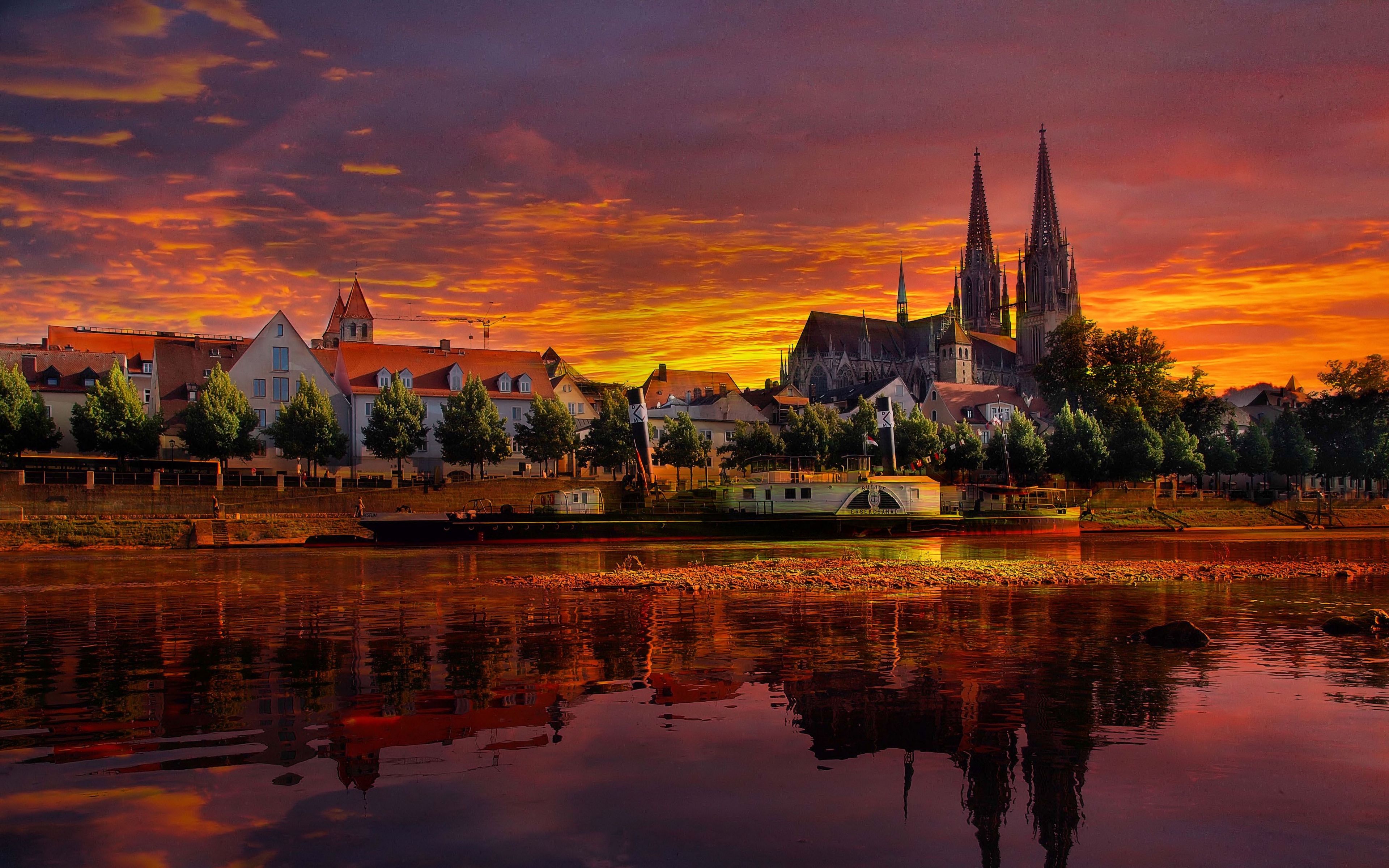 Descargar fondo de pantalla 3840x2400 regensburg, alemania, puesta de sol, paisaje urbano
